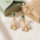 Modern Arc Emerald Gold Drop Earrings
